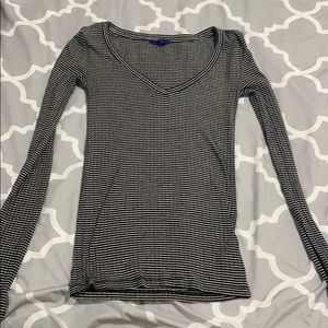 A long sleeved white and black striped v neck